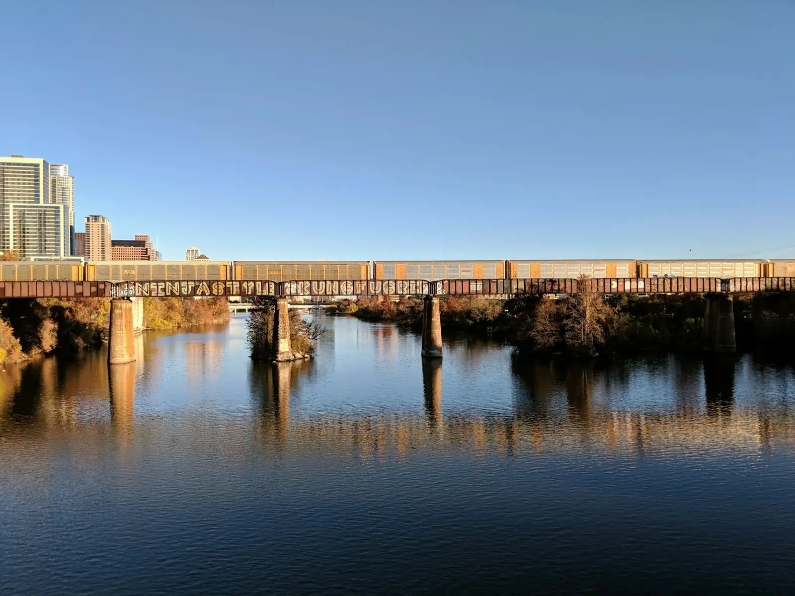 Rail bridge crossing the water in central Austin