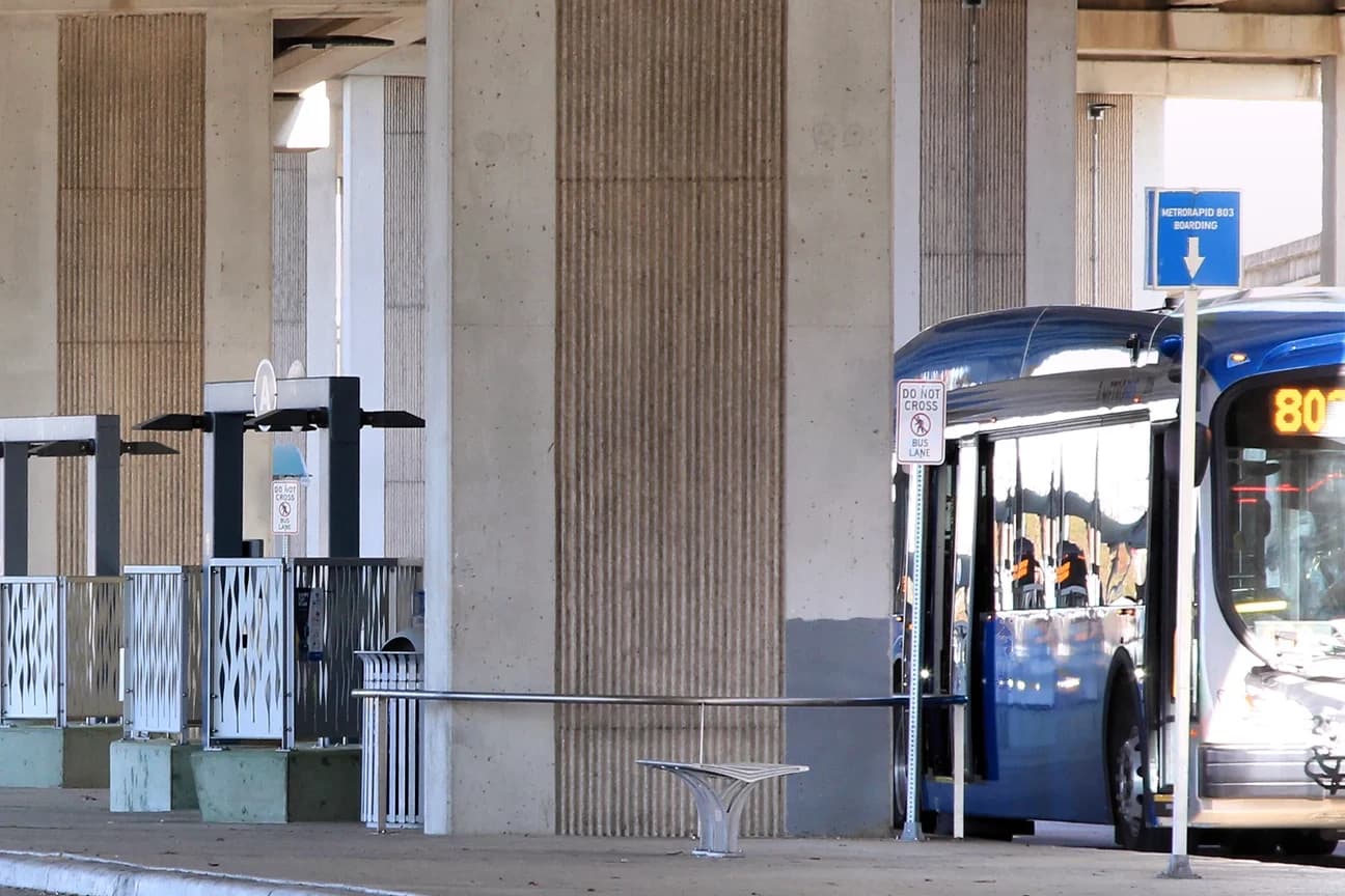 A CapMetro MetroRapid 803 bus at the Westgate Transit Center under the Ben White Boulevard overpass, on the northern edge of ZIP code 78745